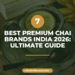 Premium chai in a clear glass cup with whole cardamom pods, ginger, cinnamon and mint showcasing bes