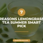 Glass cup of lemongrass tea for summer with fresh lemongrass and mint on marble counter