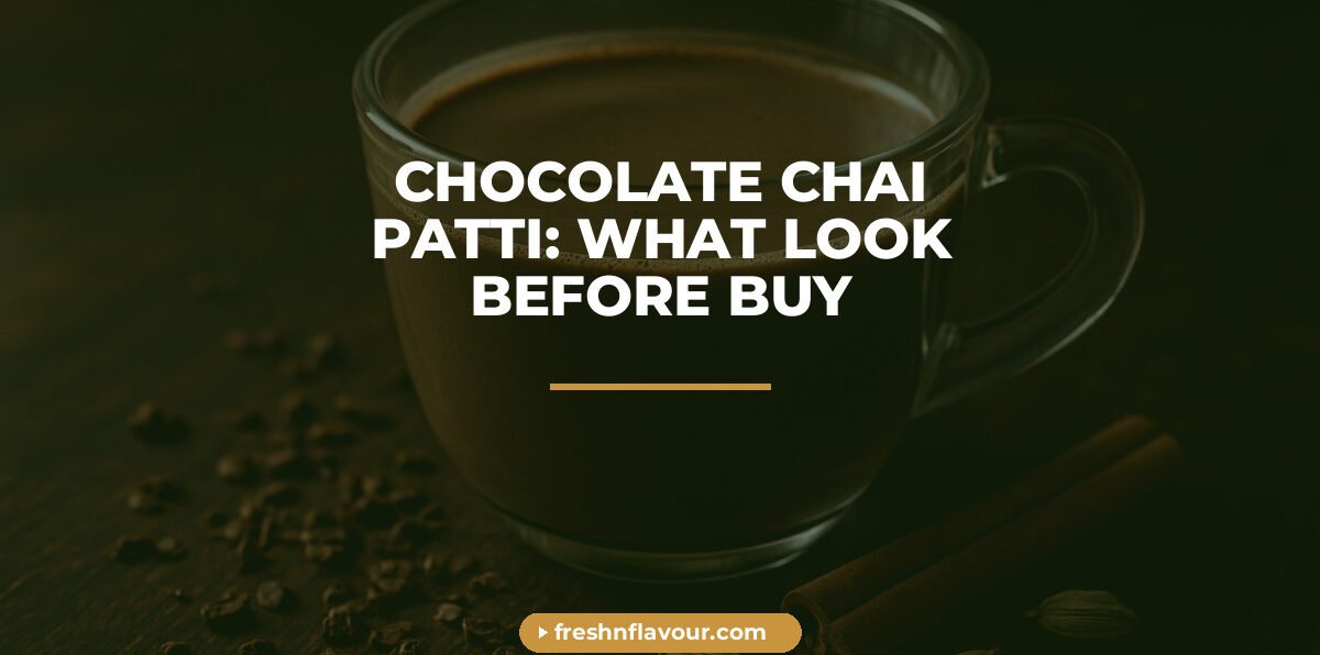 Glass cup of chocolate chai patti brewed with milk, cocoa nibs and cinnamon alongside