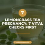 Cup of lemongrass tea in pregnancy safety check with fresh lemongrass and cardamom nearby