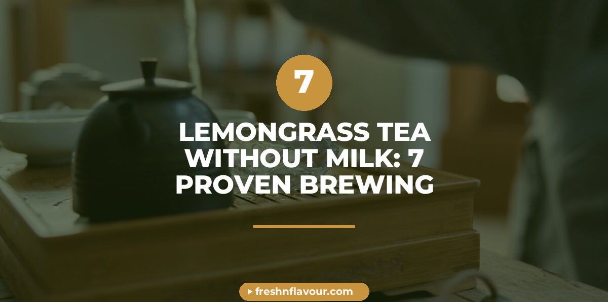 Glass cup of lemongrass tea without milk surrounded by fresh lemongrass and cardamom