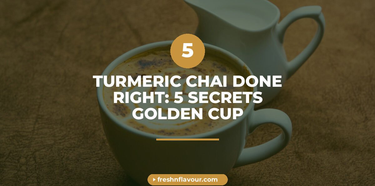 Golden turmeric chai in a glass cup with fresh turmeric root and cinnamon on a wooden table